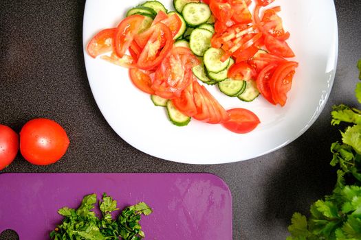 Slicing tomatoes on a cutting board with a knife