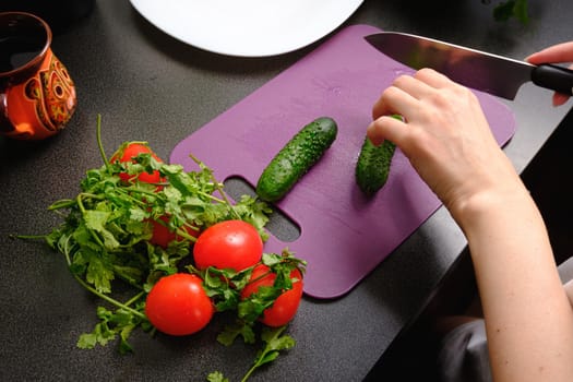 Slicing cucumbers on a cutting board