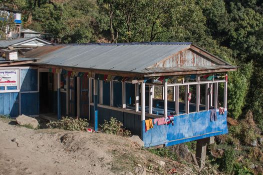 Simple tea house with buddhist praying flags along Annapurna circuit, Nepal