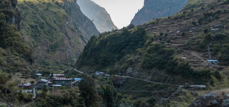 Panorama of nepalese mountain village with rice plantation terraces over the Marshyangdi river, Annapurna circuit, Himalaya, Nepal, Asia