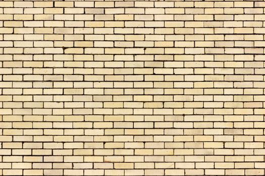 A light yellow sand colour brick wall from a distance.