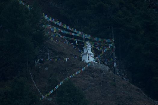 Buddhist stupa and prayer flags on the mountain side, Chame, Annapurna circuit, Himalaya, Nepal, Asia