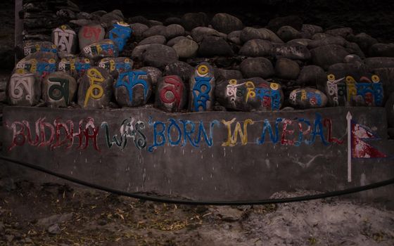 Buddha was born in Nepal, colorful religious engraings in stone, Chame, Annapurna circuit, Nepal