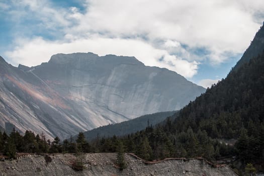 Mountain wall by Upper Pisang sunny day December, Annapurna circuit, Nepal