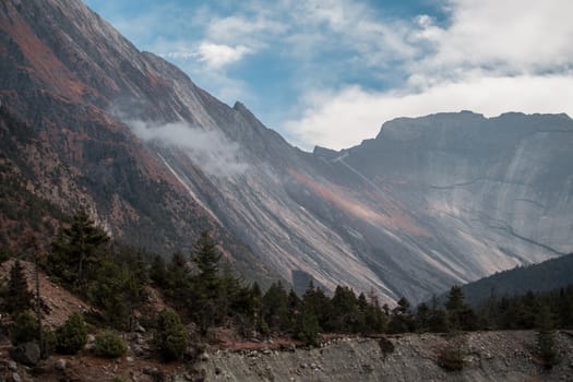 Mountain wall by Upper Pisang sunny day December, Annapurna circuit, Nepal