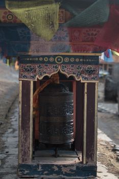 Buddhist prayer wheels and flags, Upper Pisang, trekking Annapurna circuit, Himalaya, Nepal