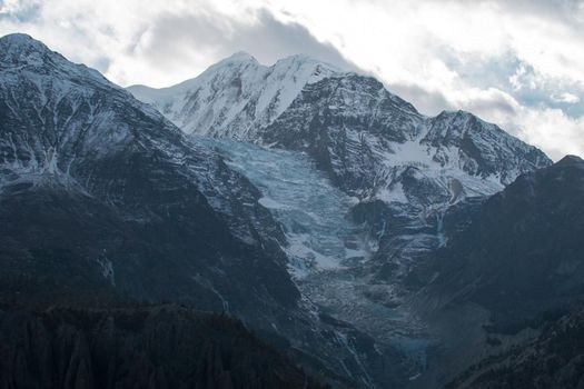 Mountain glacier over Manang village, trekking Annapurna circuit, Himalaya, Nepal