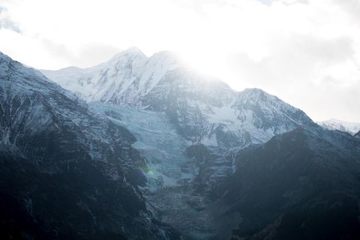 Mountain glacier over Manang village, trekking Annapurna circuit, Himalaya, Nepal