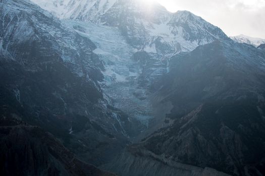 Mountain glacier over Manang village, trekking Annapurna circuit, Himalaya, Nepal