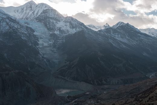 Mountain glacier over Manang village, trekking Annapurna circuit, Himalaya, Nepal