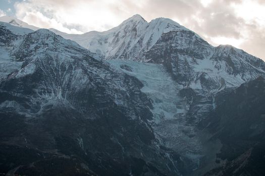 Mountain glacier over Manang village, trekking Annapurna circuit, Himalaya, Nepal