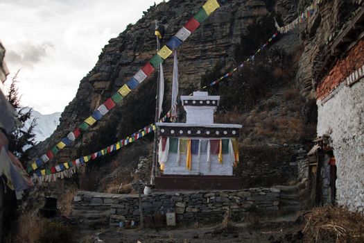 Buddhist monument by Praken Gompa over Manang village