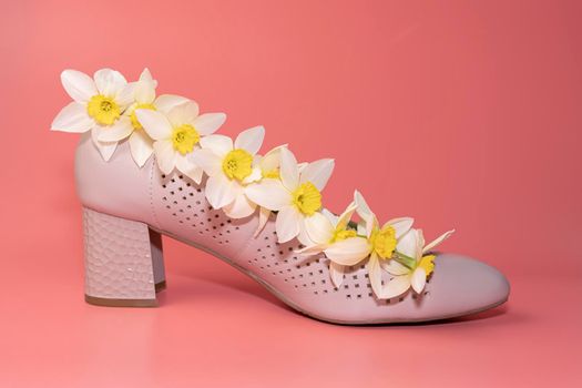 women's shoe with flowers on a pink background. High quality photo