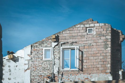 Close up of house front on a construction site, blue sky
