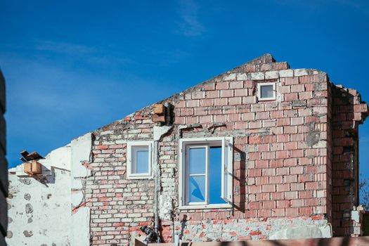 Close up of house front on a construction site, blue sky
