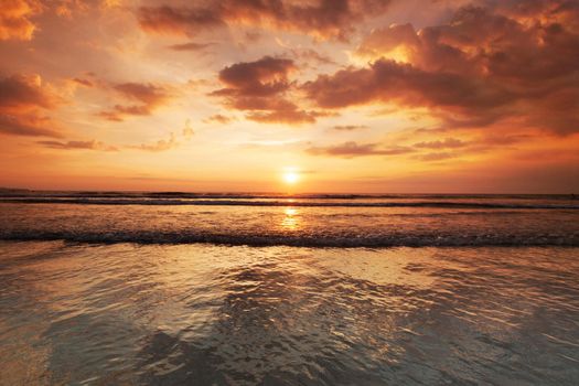 Radiant sunset from Bali Double Six beach surf waves and colorful clouds