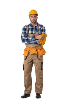 Contractor worker in coveralls and hardhat standing with arms crossed isolated on white background, full length portrait