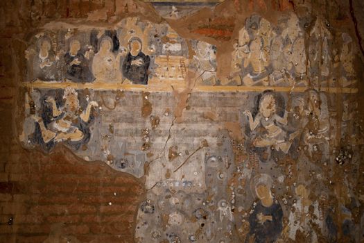 BAGAN, NYAUNG-U, MYANMAR - 2 JANUARY 2020: Historical wall paintings and drawings inside a pagoda temple in Pagan