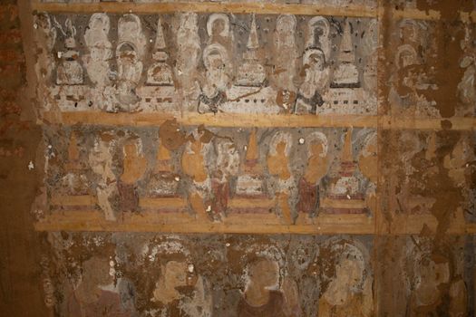 BAGAN, NYAUNG-U, MYANMAR - 2 JANUARY 2020: Historical wall paintings and drawings inside a pagoda temple in Pagan