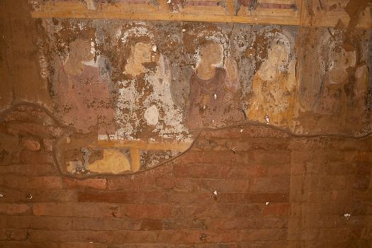 BAGAN, NYAUNG-U, MYANMAR - 2 JANUARY 2020: Historical wall paintings and drawings inside a pagoda temple in Pagan