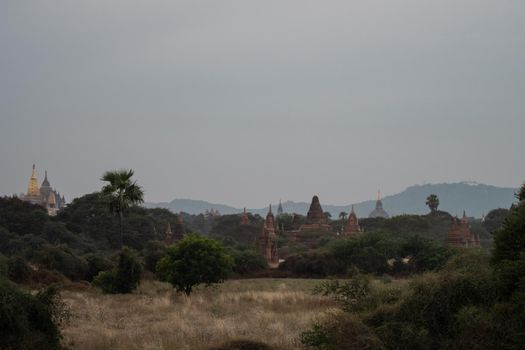 BAGAN, NYAUNG-U, MYANMAR - 2 JANUARY 2020: A few historical and religious pagoda temples from the old Pagan kingdom