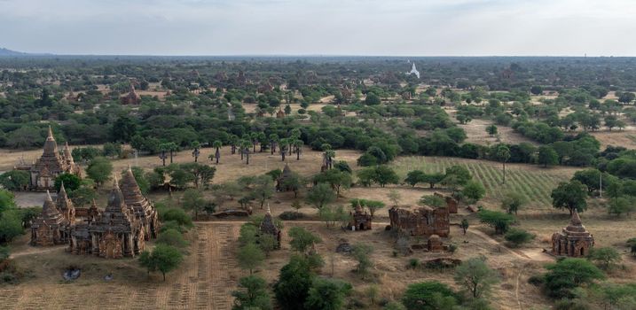 BAGAN, NYAUNG-U, MYANMAR - 3 JANUARY 2020: Looking out over the vast plains of Bagan with its historical temples and fields from the tall Nan Myint viewing tower