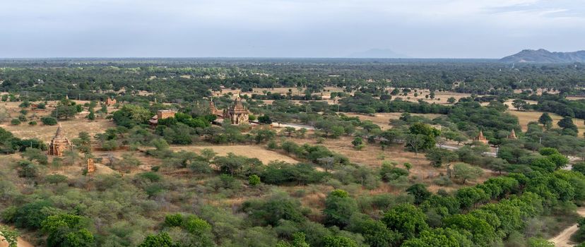 BAGAN, NYAUNG-U, MYANMAR - 3 JANUARY 2020: Looking out over the vast plains of Bagan with its historical temples and fields from the tall Nan Myint viewing tower