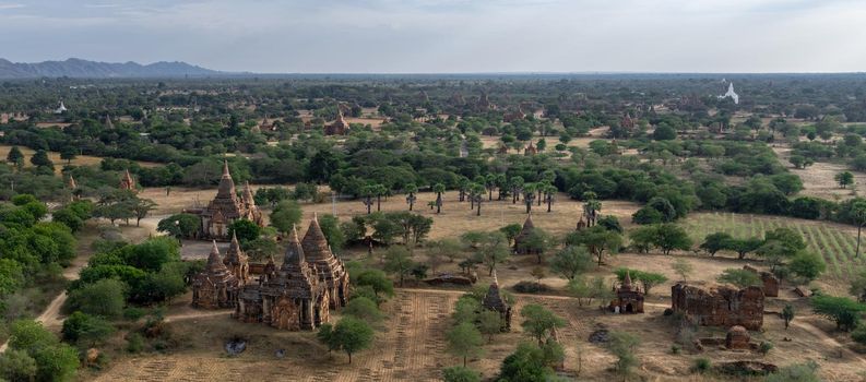 BAGAN, NYAUNG-U, MYANMAR - 3 JANUARY 2020: Looking out over the vast plains of Bagan with its historical temples and fields from the tall Nan Myint viewing tower