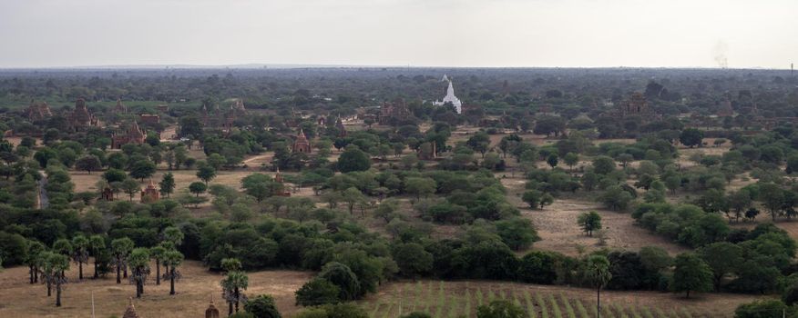 BAGAN, NYAUNG-U, MYANMAR - 3 JANUARY 2020: Looking out over the vast plains of Bagan with its historical temples and fields from the tall Nan Myint viewing tower