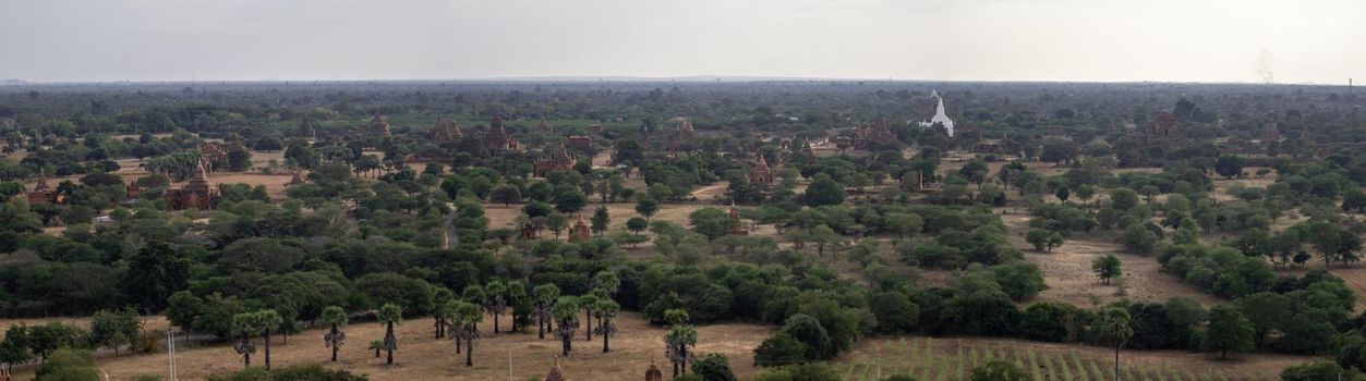 BAGAN, NYAUNG-U, MYANMAR - 3 JANUARY 2020: Looking out over the vast plains of Bagan with its historical temples and fields from the tall Nan Myint viewing tower