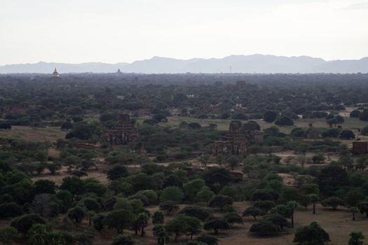 BAGAN, NYAUNG-U, MYANMAR - 3 JANUARY 2020: Looking out over the vast plains of Bagan with its historical temples and fields from the tall Nan Myint viewing tower