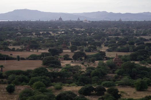 BAGAN, NYAUNG-U, MYANMAR - 3 JANUARY 2020: Looking out over the vast plains of Bagan with its historical temples and fields from the tall Nan Myint viewing tower