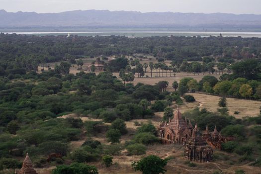 BAGAN, NYAUNG-U, MYANMAR - 3 JANUARY 2020: Looking out over the vast plains of Bagan with its historical temples and fields from the tall Nan Myint viewing tower