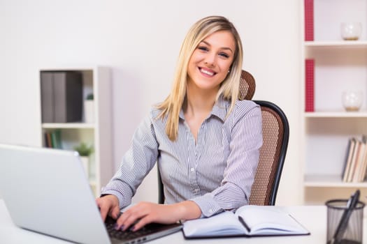 Beautiful businesswoman working at her office.