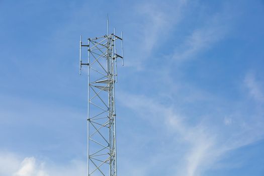 Antenna repeater on blue sky, cellular telecommunication transmitter, 4g or 5g mobile internet network