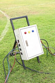 Old and dirty outdoor electrical power distribution box with circuit breaker and signal lights, industrial high voltage electricity safety equipment 
