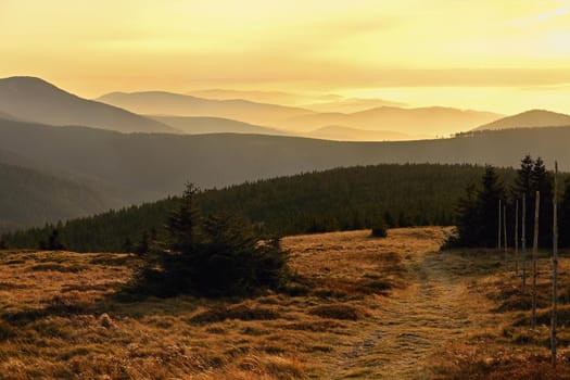 Beautiful landscape and sunset in the mountains. Hills in clouds. Jeseniky - Czech Republic - Europe.