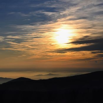 Beautiful landscape and sunset in the mountains. Hills in clouds. Jeseniky - Czech Republic - Europe.