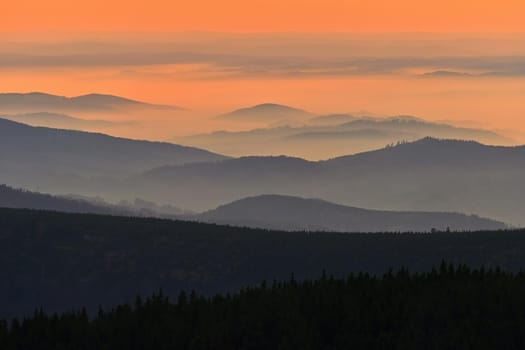 Beautiful landscape and sunset in the mountains. Hills in clouds. Jeseniky - Czech Republic - Europe.