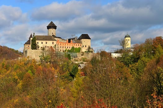 Beautiful old romantic castle Sovinec at sunset with autumn landscape.