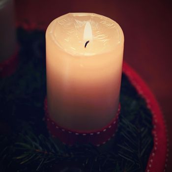 Beautiful Christmas candlelight with candle. Concept for Christmas Winter Time.