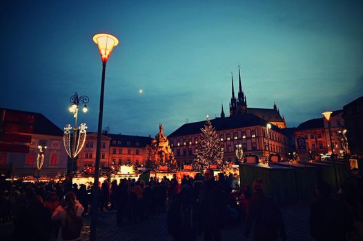 1 December 2019 Brno. Christmas holidays in the center of Brno. Street with shops and Christmas decor with people