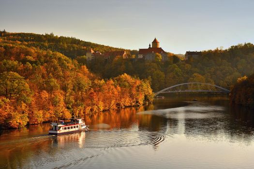 Beautiful Autumn Landscape with Veveri Castle. Natural colorful scenery with sunset. Brno dam-Czech Republic-Europe.