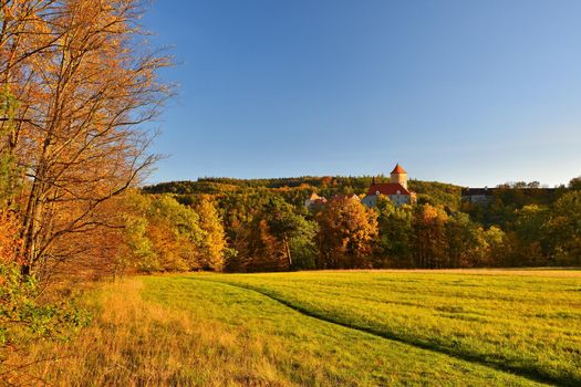 Beautiful Autumn Landscape with Veveri Castle. Natural colorful scenery with sunset. Brno dam-Czech Republic-Europe.