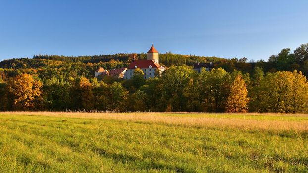 Beautiful Autumn Landscape with Veveri Castle. Natural colorful scenery with sunset. Brno dam-Czech Republic-Europe.