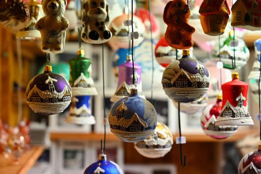 Beautiful old Christmas decorations hanging on a stall at the Christmas markets. Classical and traditional Czech ornaments.