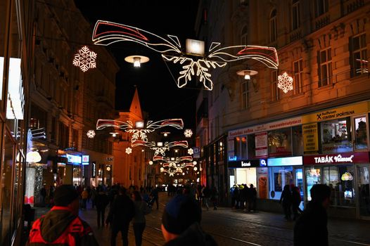 1 December 2019 Brno. Christmas holidays in the center of Brno. Street with shops and Christmas decor with people