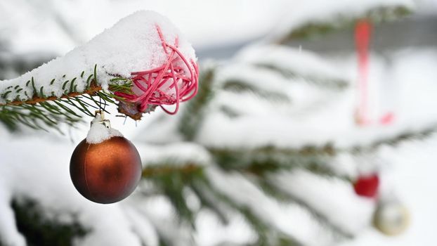 Christmas. Beautiful Christmas ornament on the Christmas tree. Seasonal background for winter holidays.