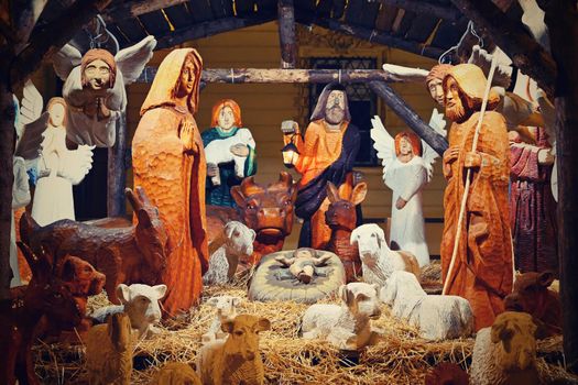 Beautiful nativity scene with baby Jesus. Traditional Christmas background of Christian holidays.