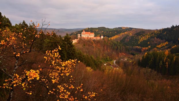Beautiful old castle in forests with autumn landscape. Castle Pernstejn - Nedvedice. Europe Czech Republic.